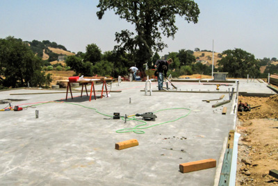 Concrete slab for a straw bale house