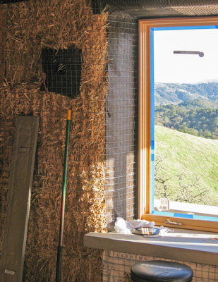 Wrapping bales in a straw bale house