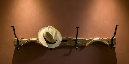 Straw bale house hat rack